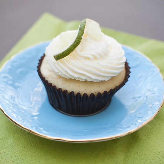 A beautiful tequila lime cupcake on a plate.